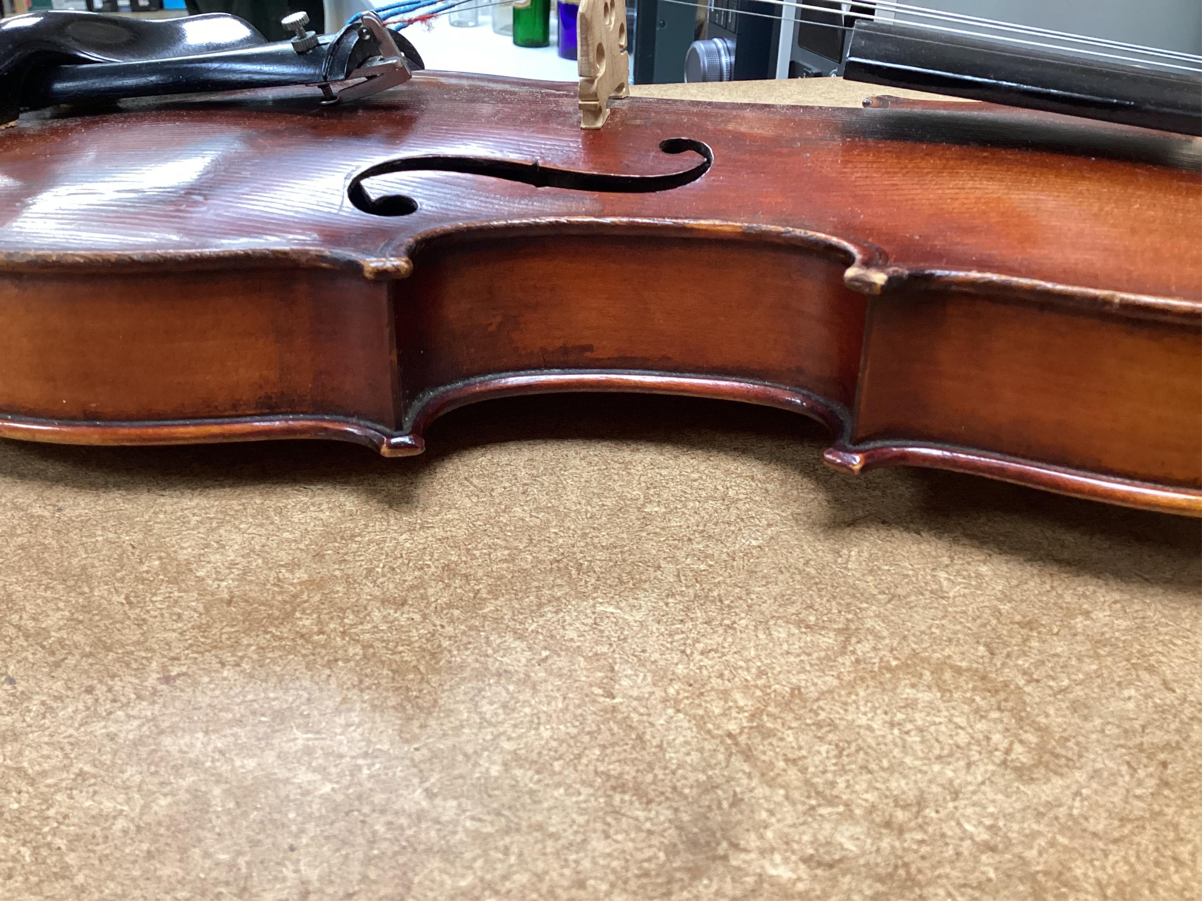 A cased late 19th century German Mittenwald violin with lion’s head scroll, and two bows, Ivory submission ref: RP2E5HT1